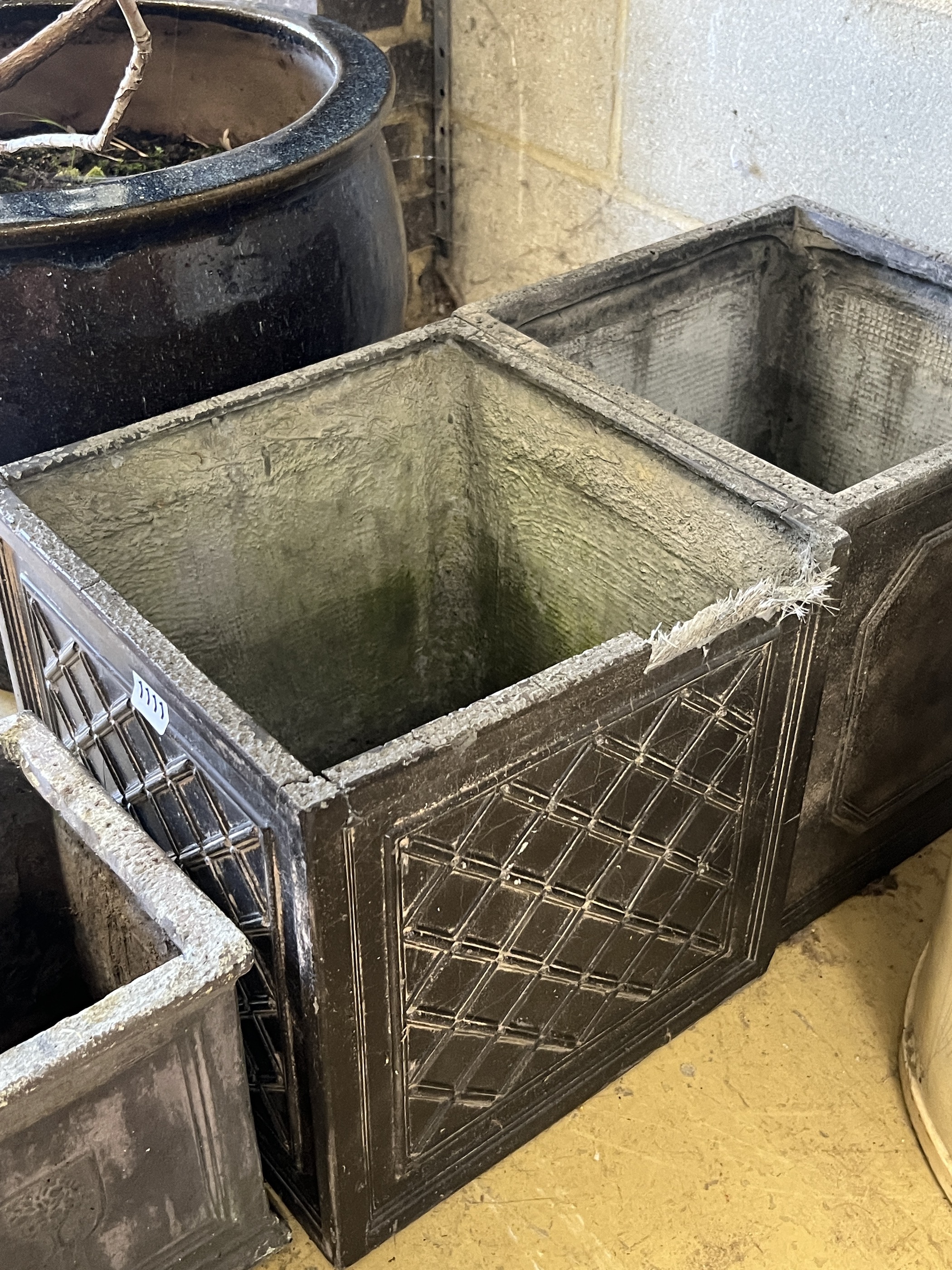 Three composition faux lead square garden planters, larger width 32cm, height 32cm